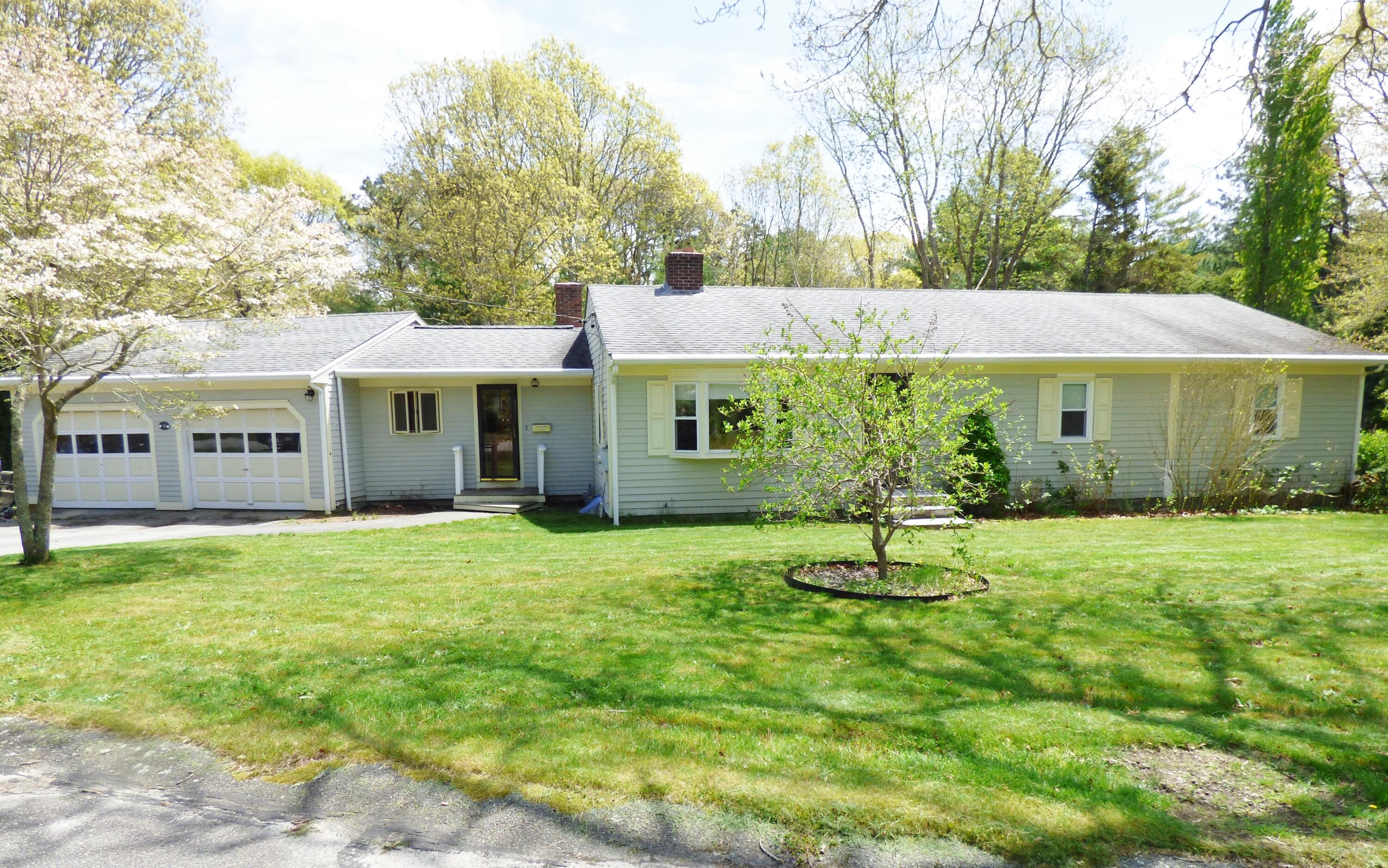 a house with garden in front of it