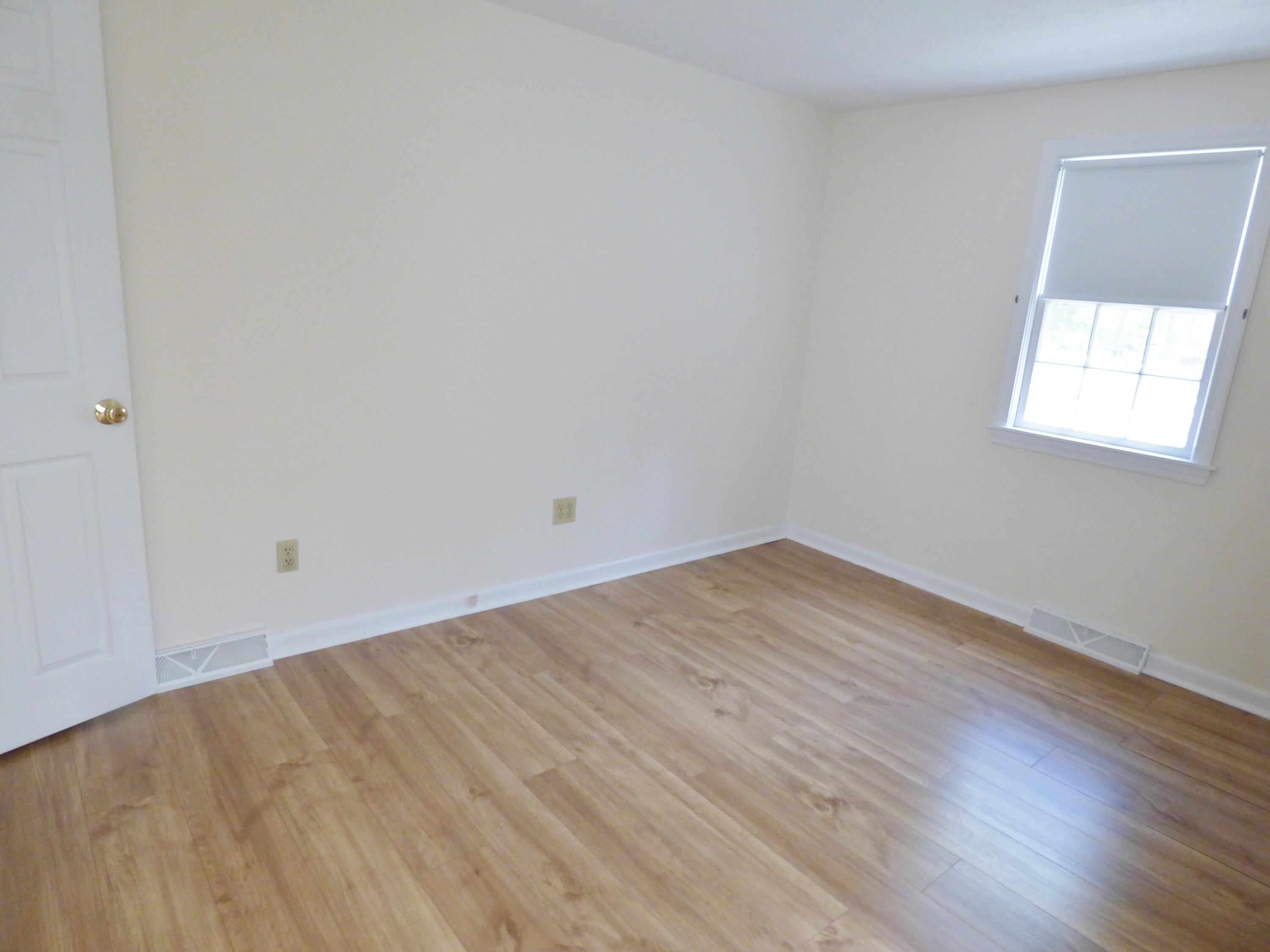 18 Limerick Court Centerville, MA 02632 - Photo 13 of 24 an empty room with wooden floor and windows