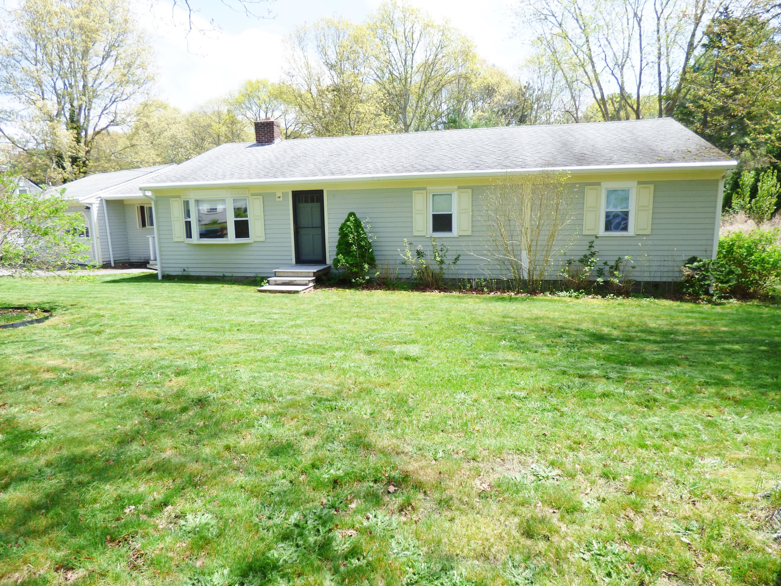18 Limerick Court Centerville, MA 02632 - Photo 18 of 24 a front view of a house with a garden