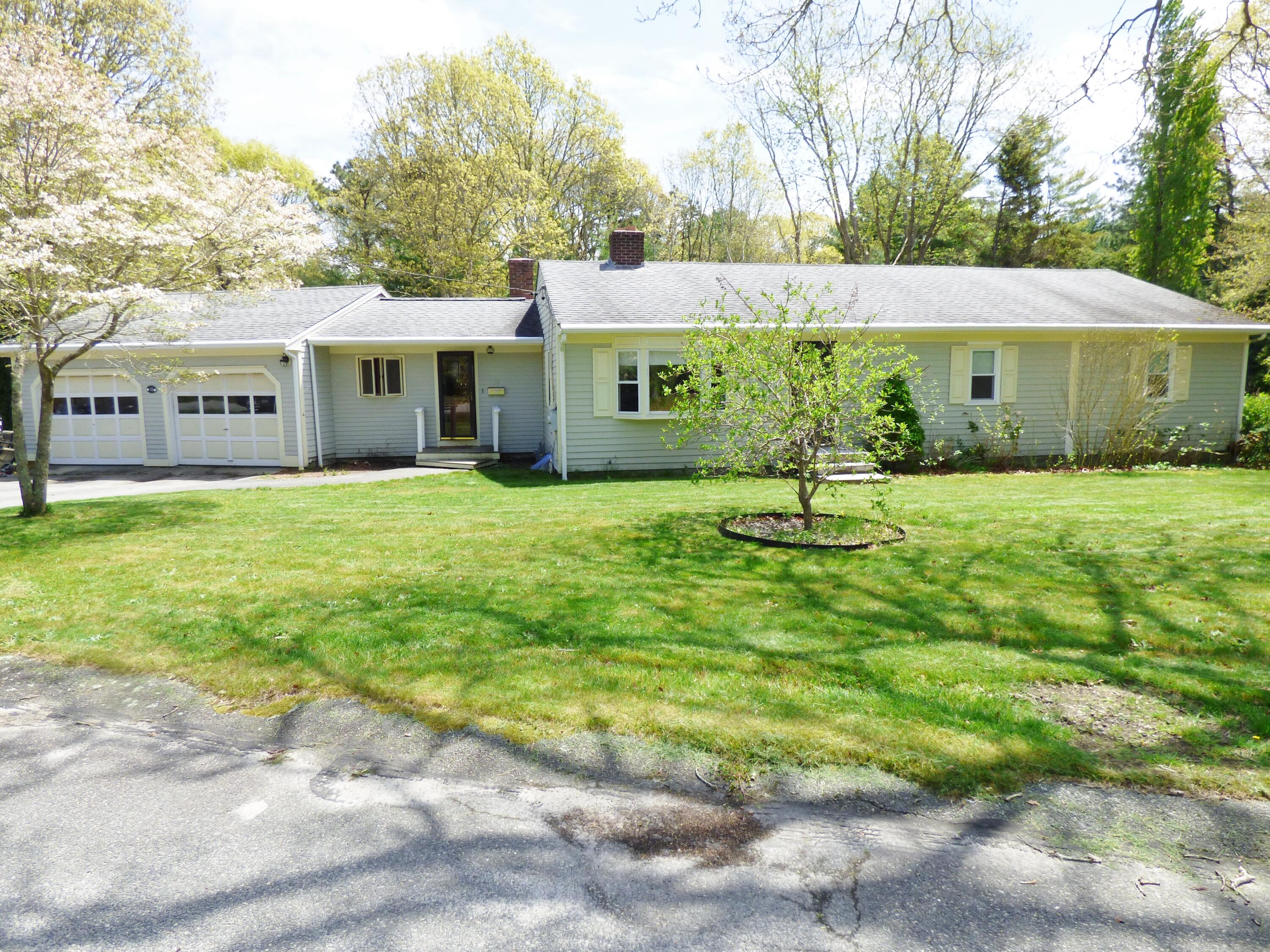 18 Limerick Court Centerville, MA 02632 - Photo 19 of 24 a front view of a house with a garden