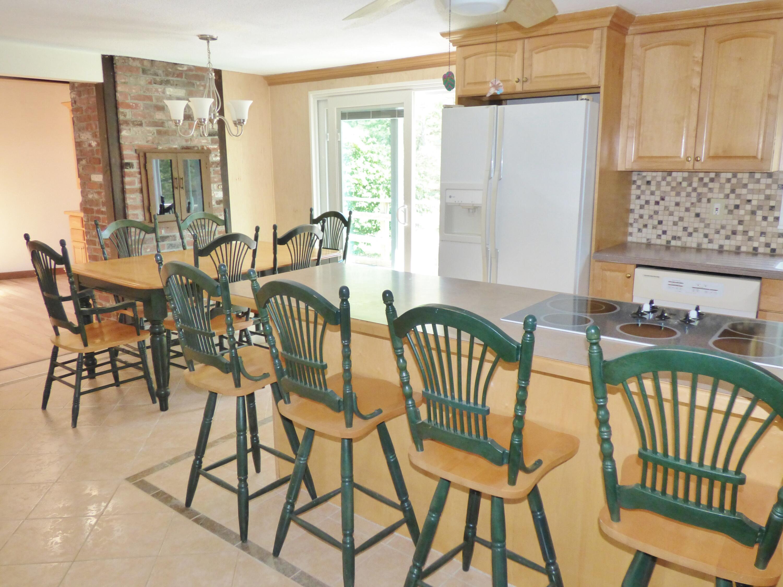 18 Limerick Court Centerville, MA 02632 - Photo 2 of 24 a view of a dining room with furniture window and outside view
