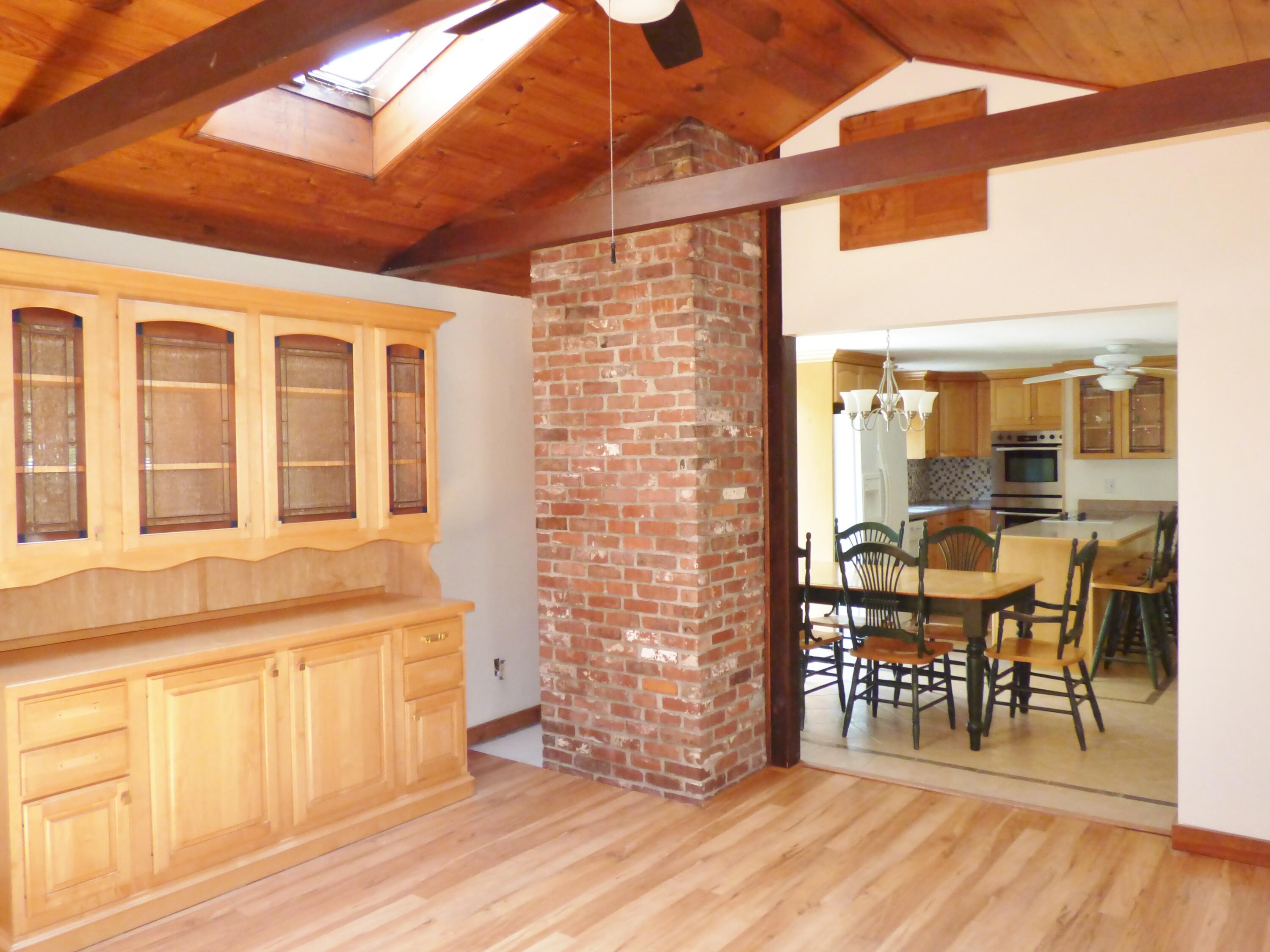 18 Limerick Court Centerville, MA 02632 - Photo 6 of 24 a dining room with wooden floor and a glass door