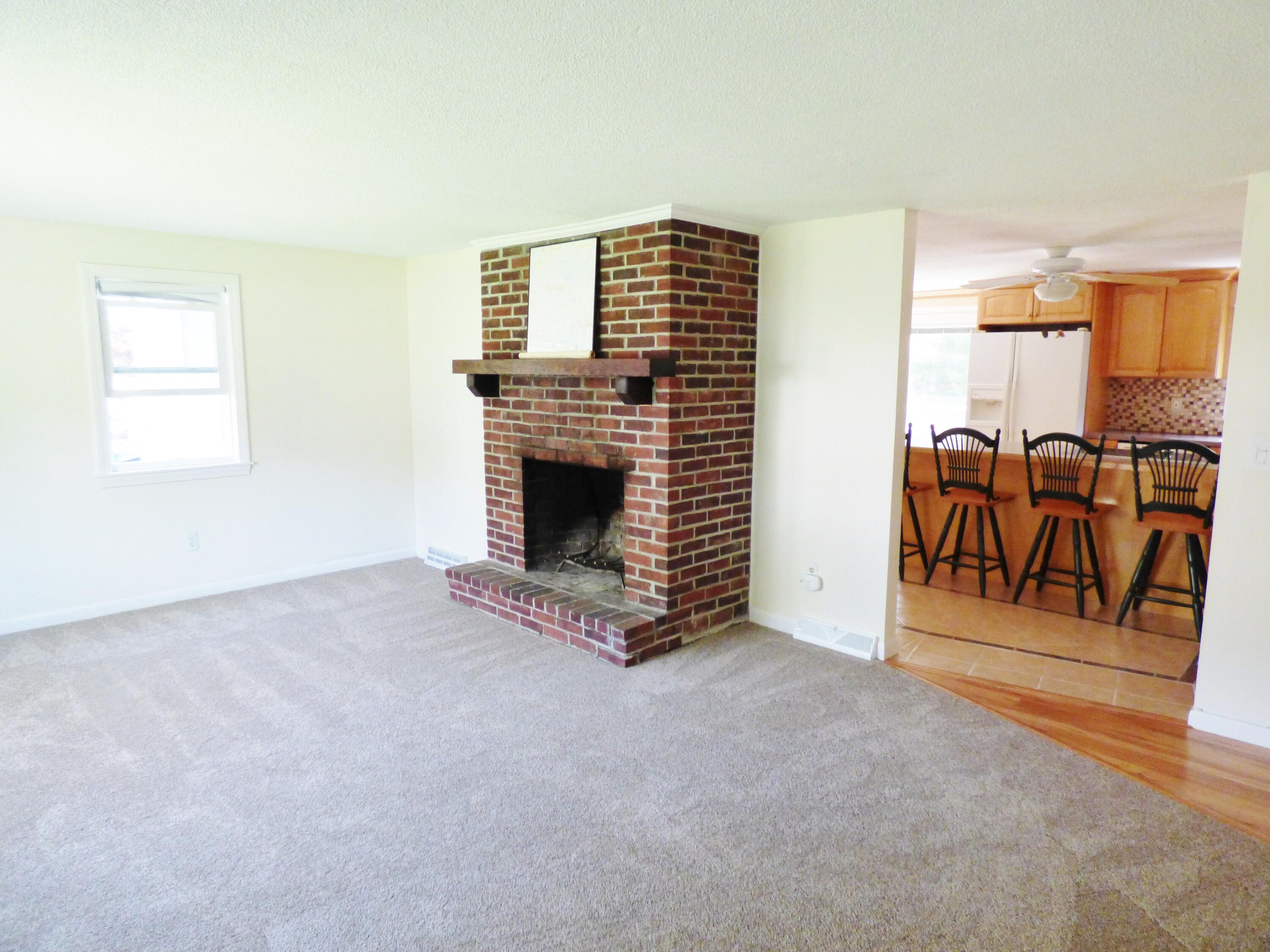 18 Limerick Court Centerville, MA 02632 - Photo 7 of 24 a view of livingroom with furniture workspace and a window