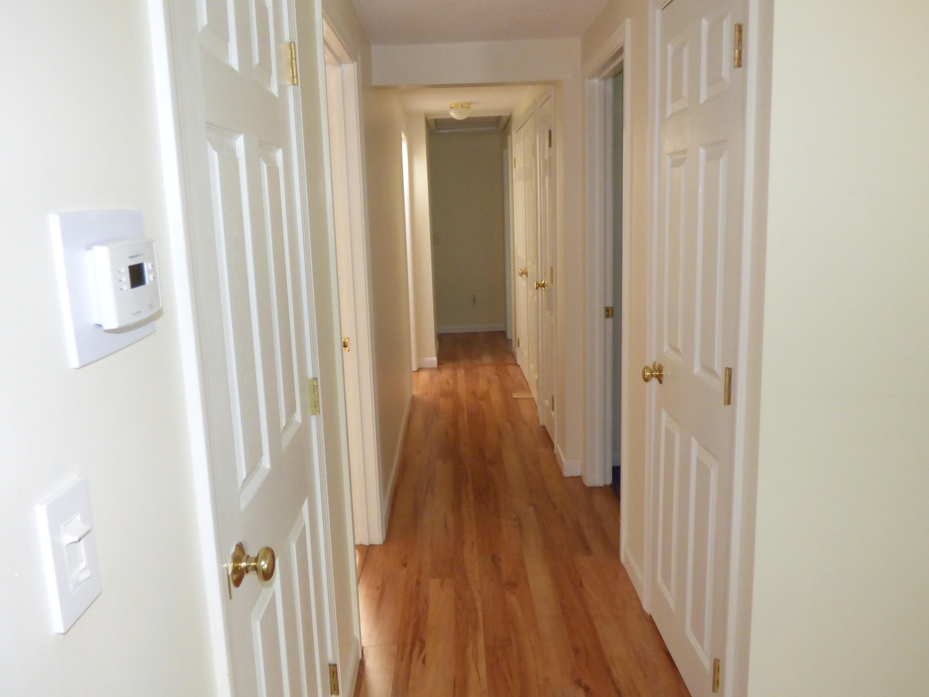 18 Limerick Court Centerville, MA 02632 - Photo 9 of 24 a view of a hallway with wooden floor
