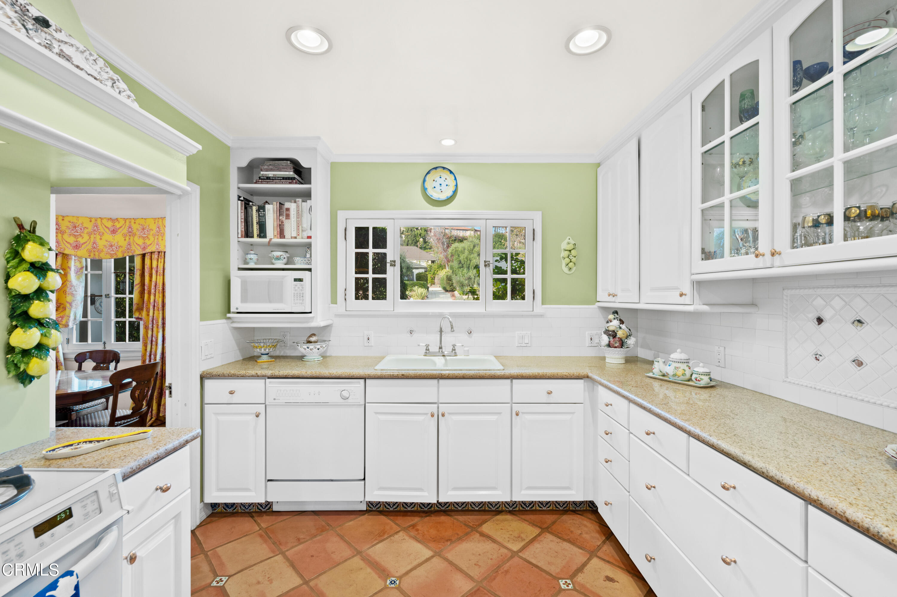 818 Old Mill Road Pasadena, CA 91108 - Photo 20 of 71 a kitchen with a sink window and cabinets