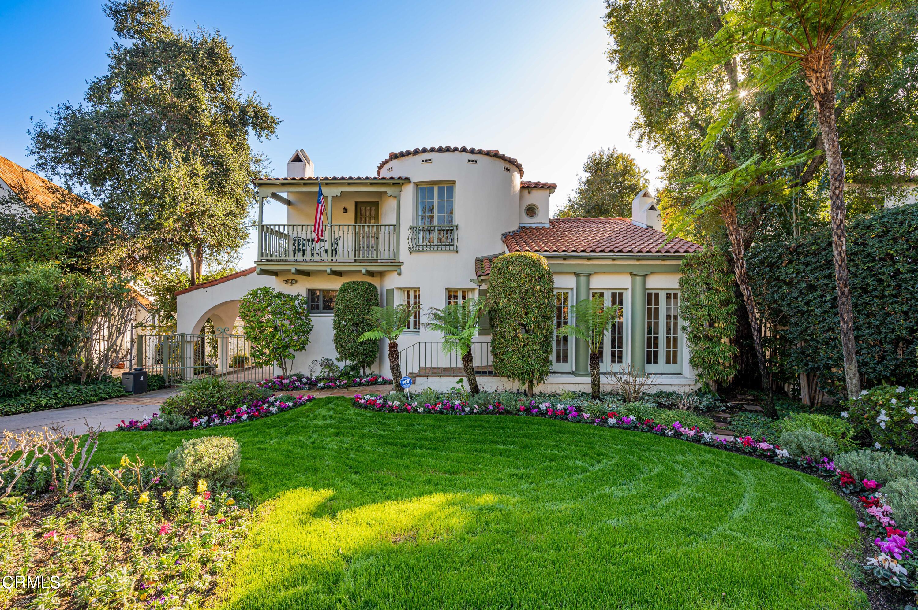 818 Old Mill Road Pasadena, CA 91108 - Photo 2 of 71 a front view of a house with a yard table and chairs
