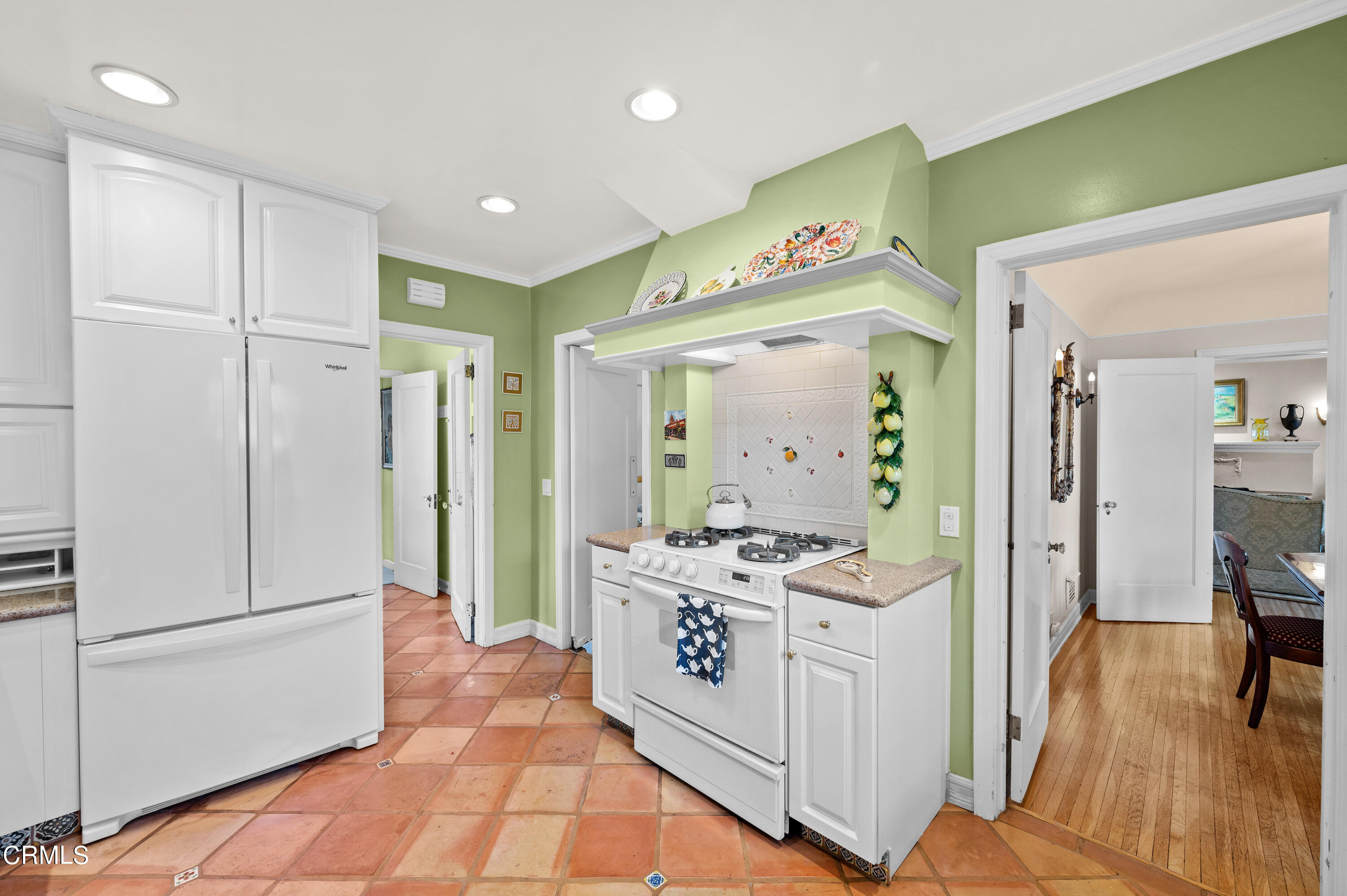 818 Old Mill Road Pasadena, CA 91108 - Photo 23 of 71 a hallway view with stainless steel appliances granite countertop a stove and a refrigerator