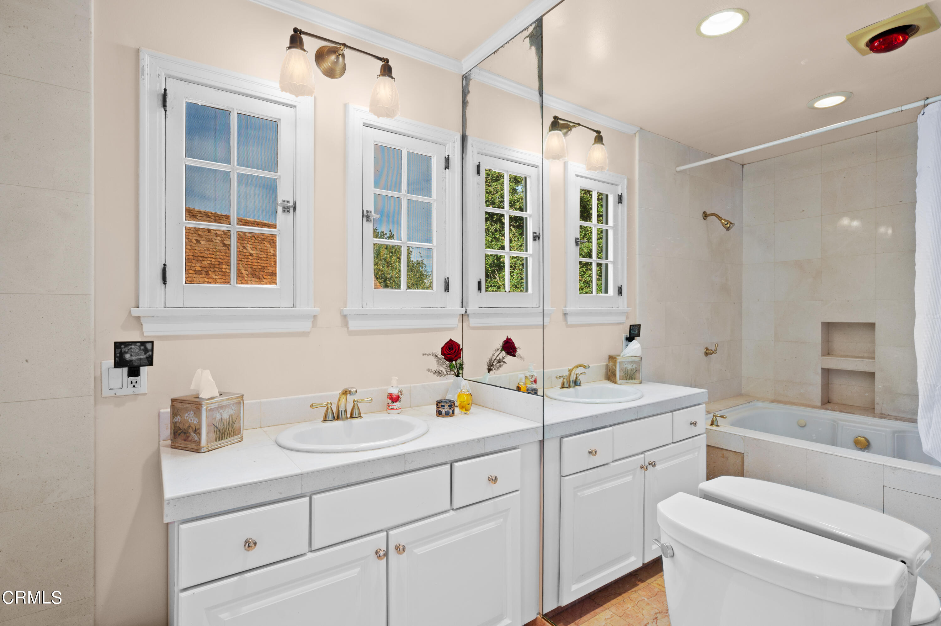 818 Old Mill Road Pasadena, CA 91108 - Photo 38 of 71 a bathroom with a sink double vanity and a shower