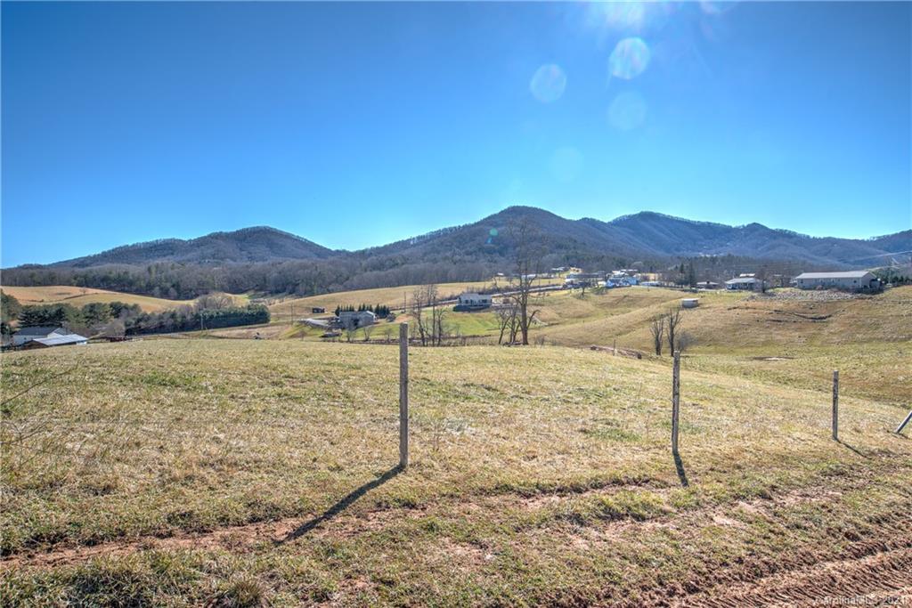 518 Old Newfound Road Leicester, NC 28748 - Photo 10 of 11 a view of an house with a yard and mountain view