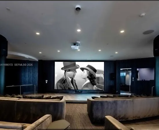 a view of a living room and floor to ceiling window
