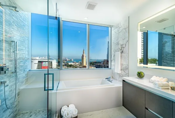 a bathroom with a bathtub and a sink