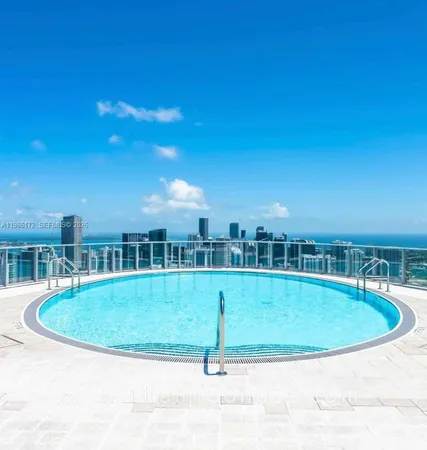a view of a swimming pool with an outdoor space and seating