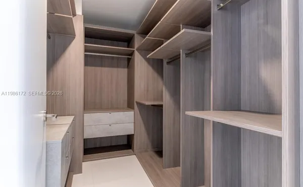 a bathroom with a tub and a shower