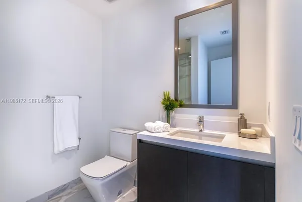 a bathroom with a sink and a toilet