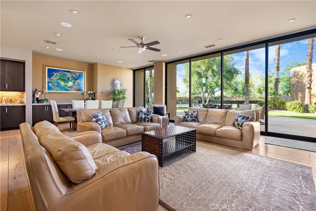68 Royal St Georges Way Rancho Mirage, CA 92270 - Photo 33 of 75 a living room with furniture and a large window