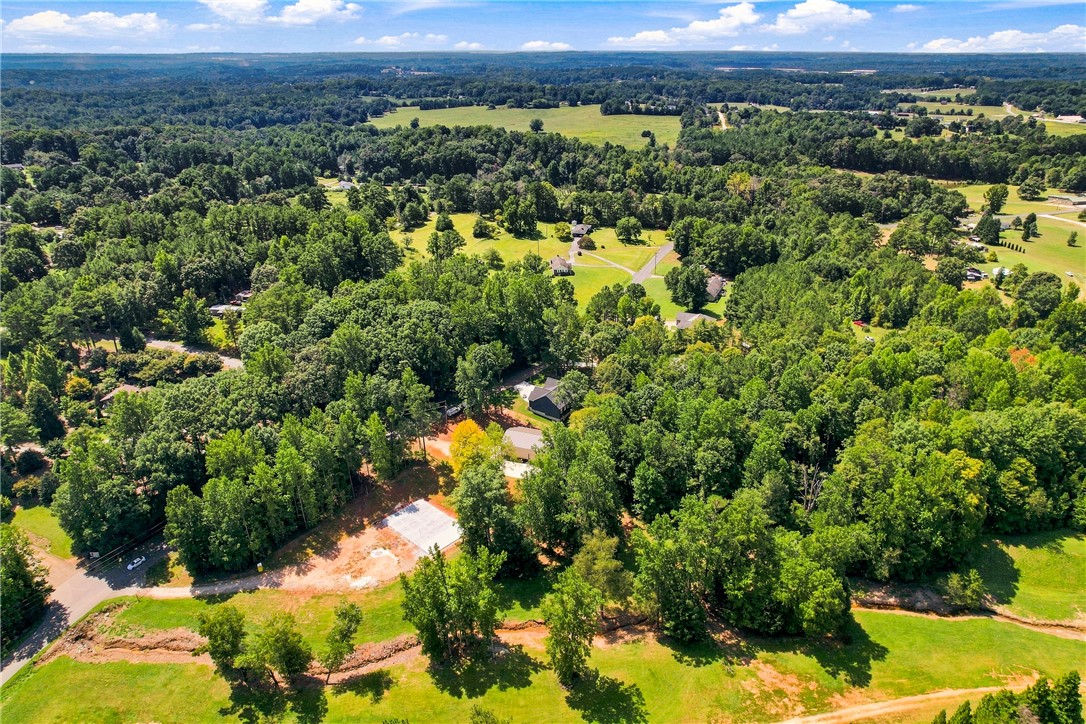 216 West Halfway Branch Road Walhalla, SC 29691 - Photo 36 of 41 Lush woodlands and rolling green pastures stretch across the scenic landscape of this expansive property.
