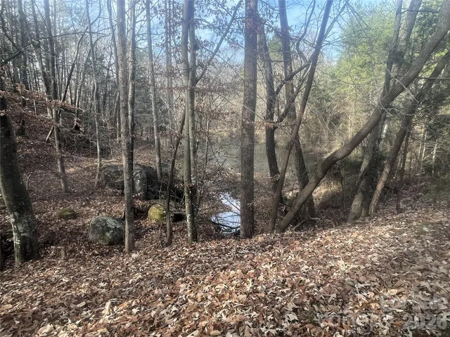 a living room with fireplace furniture and a flat screen tv
