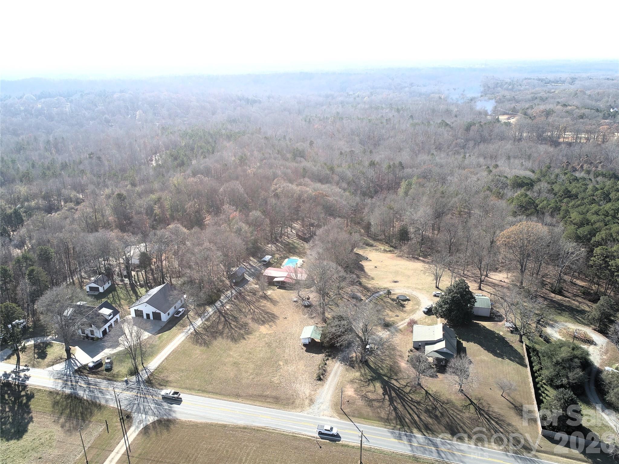 11443 Mooresville Road Davidson, NC 28036 - Photo 2 of 47 an aerial view of residential houses with outdoor space