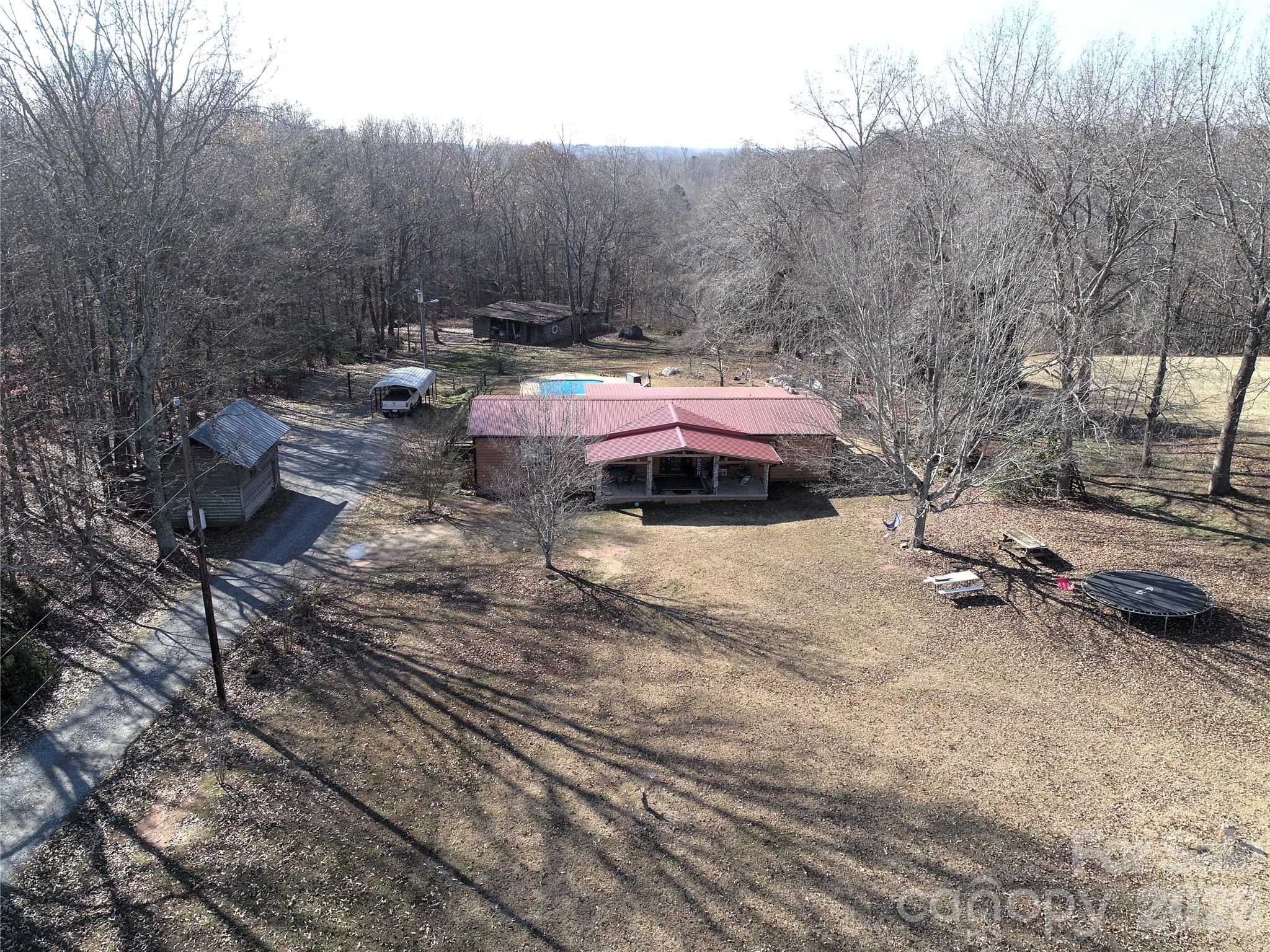 11443 Mooresville Road Davidson, NC 28036 - Photo 22 of 47 a backyard of a house with table and chairs