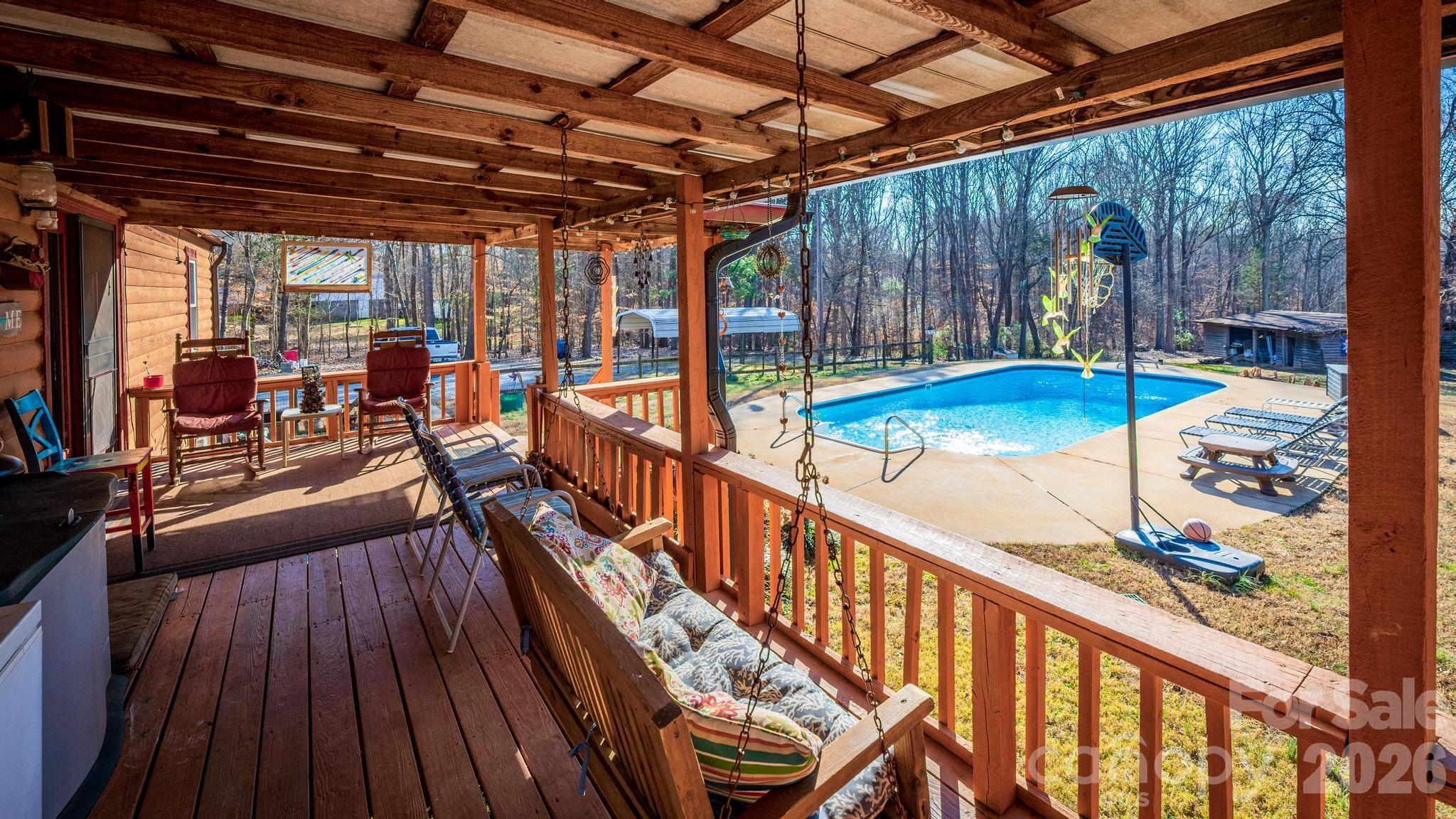 11443 Mooresville Road Davidson, NC 28036 - Photo 30 of 47 a view of swimming pool with outdoor seating