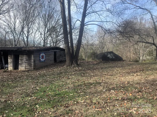 a view of a backyard with sitting area