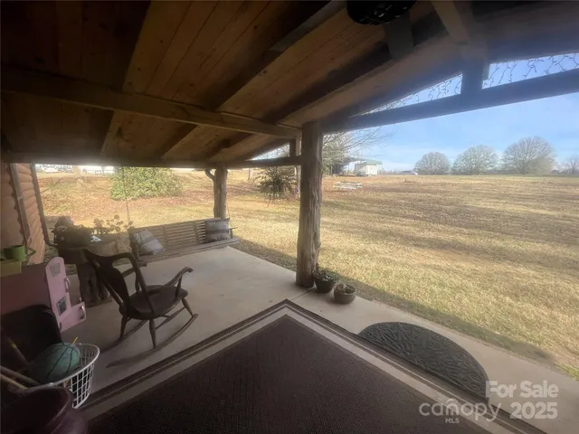 a view of a backyard with furniture