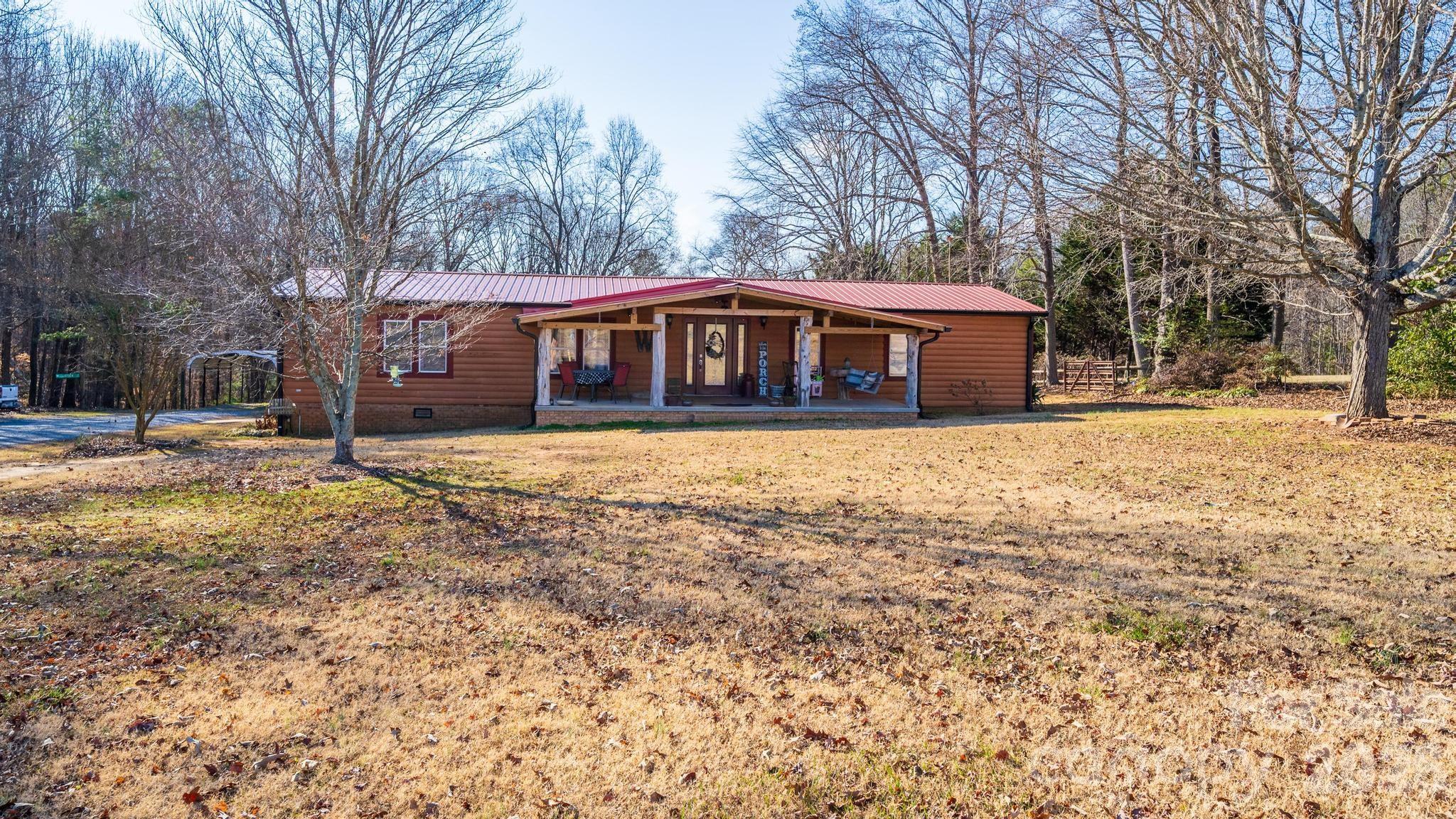 11443 Mooresville Road Davidson, NC 28036 - Photo 4 of 47 a view of a house with a yard