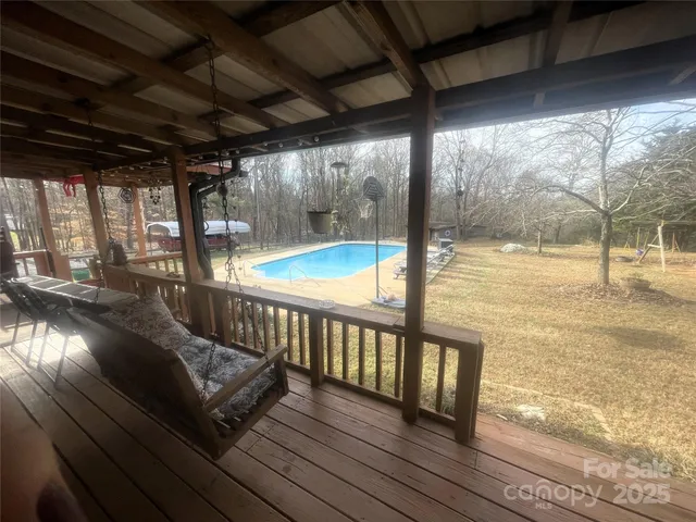 a view of balcony with wooden floor