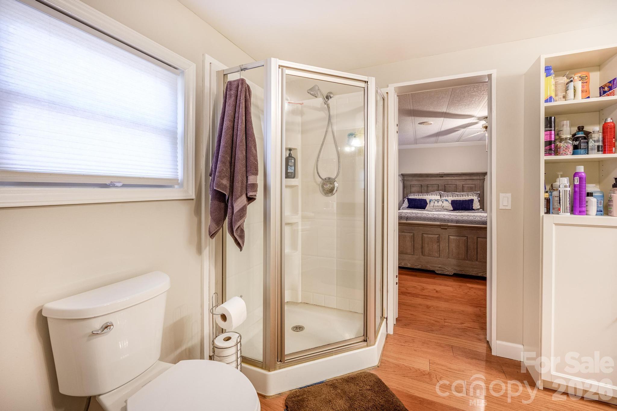 11443 Mooresville Road Davidson, NC 28036 - Photo 43 of 47 a bathroom with a toilet and a shower