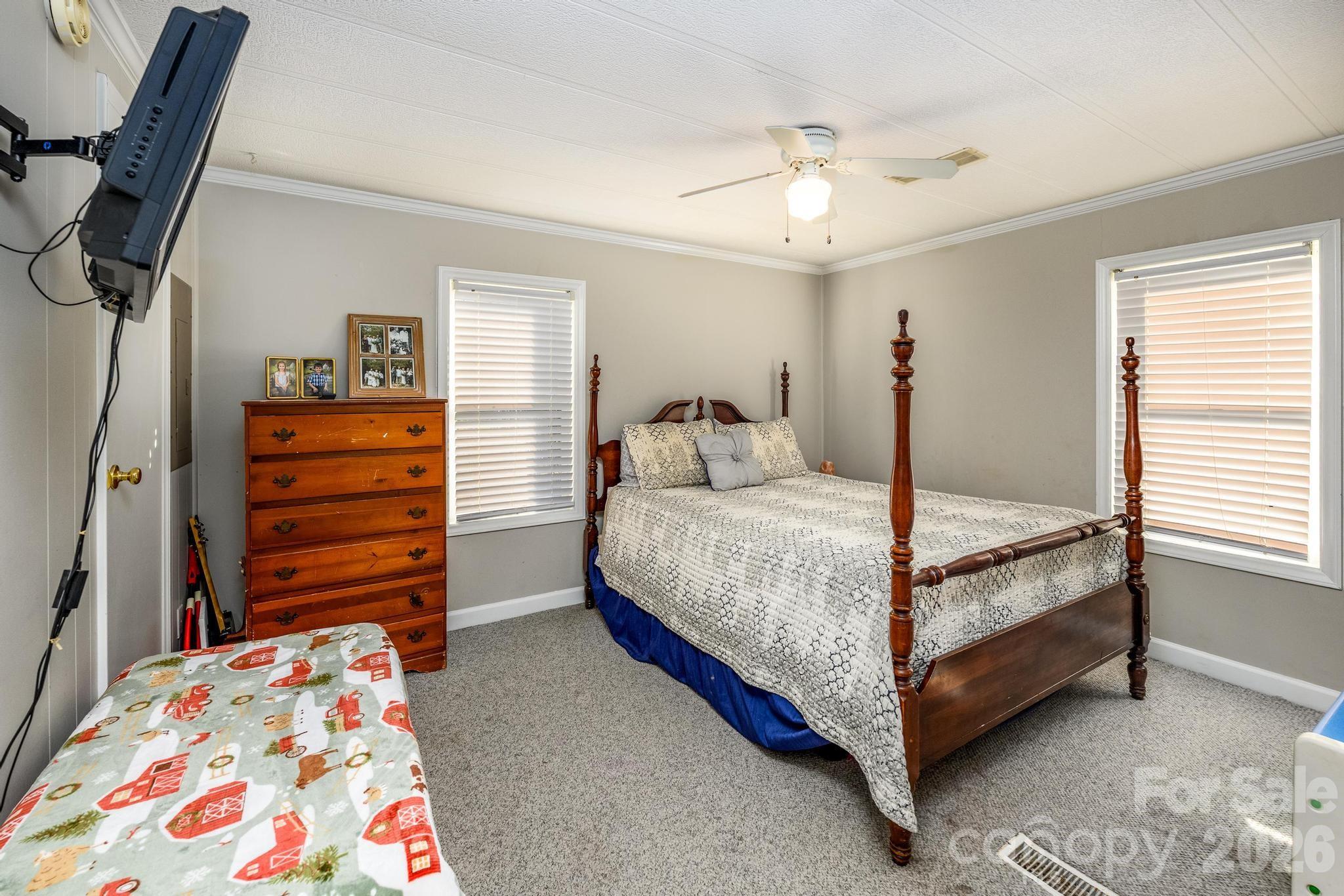 11443 Mooresville Road Davidson, NC 28036 - Photo 44 of 47 a bedroom with a bed and a dresser