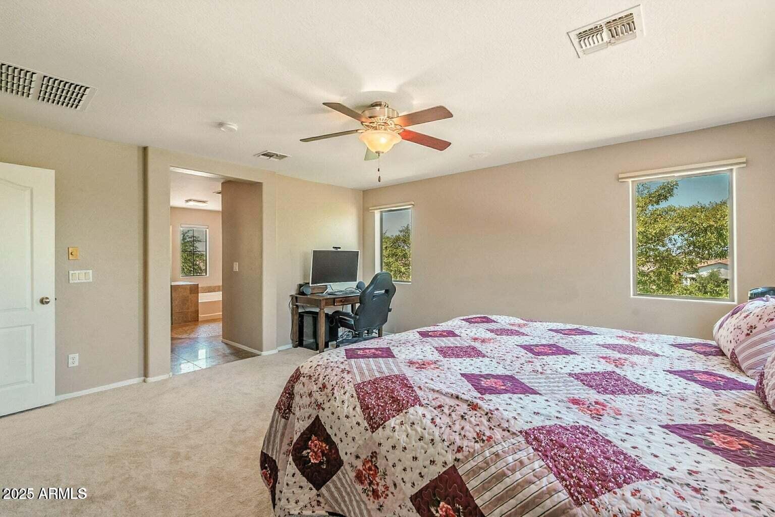 7169 South Dodane Court Gilbert, AZ 85298 - Photo 16 of 23 a bedroom with a bed and a chandelier