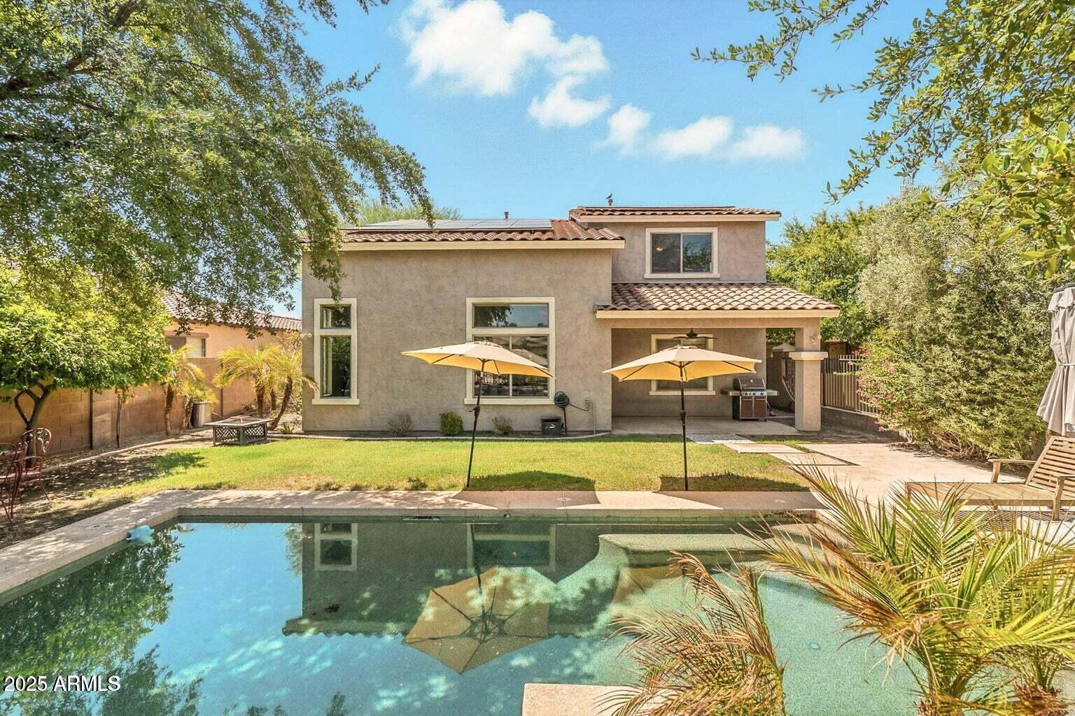 7169 South Dodane Court Gilbert, AZ 85298 - Photo 21 of 23 a view of a house with swimming pool