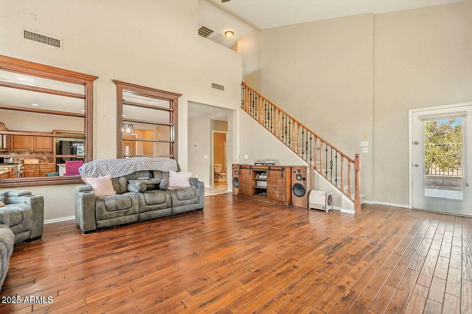 7169 South Dodane Court Gilbert, AZ 85298 - Photo 4 of 23 a living room with furniture and a wooden floor