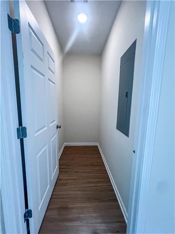 6590 Old Still Trail Gainesville, GA 30506 - Photo 15 of 17 a view of a hallway with wooden floor and staircase