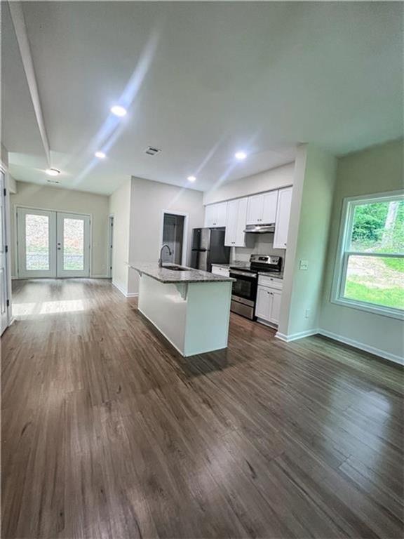 6590 Old Still Trail Gainesville, GA 30506 - Photo 3 of 17 a view of kitchen with wooden floor and electronic appliances