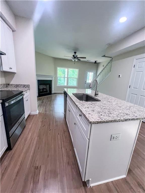 6590 Old Still Trail Gainesville, GA 30506 - Photo 5 of 17 a kitchen with sink stove and refrigerator
