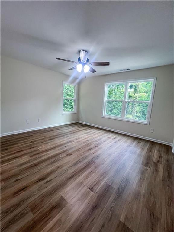 6590 Old Still Trail Gainesville, GA 30506 - Photo 8 of 17 wooden floor in an empty room with a window