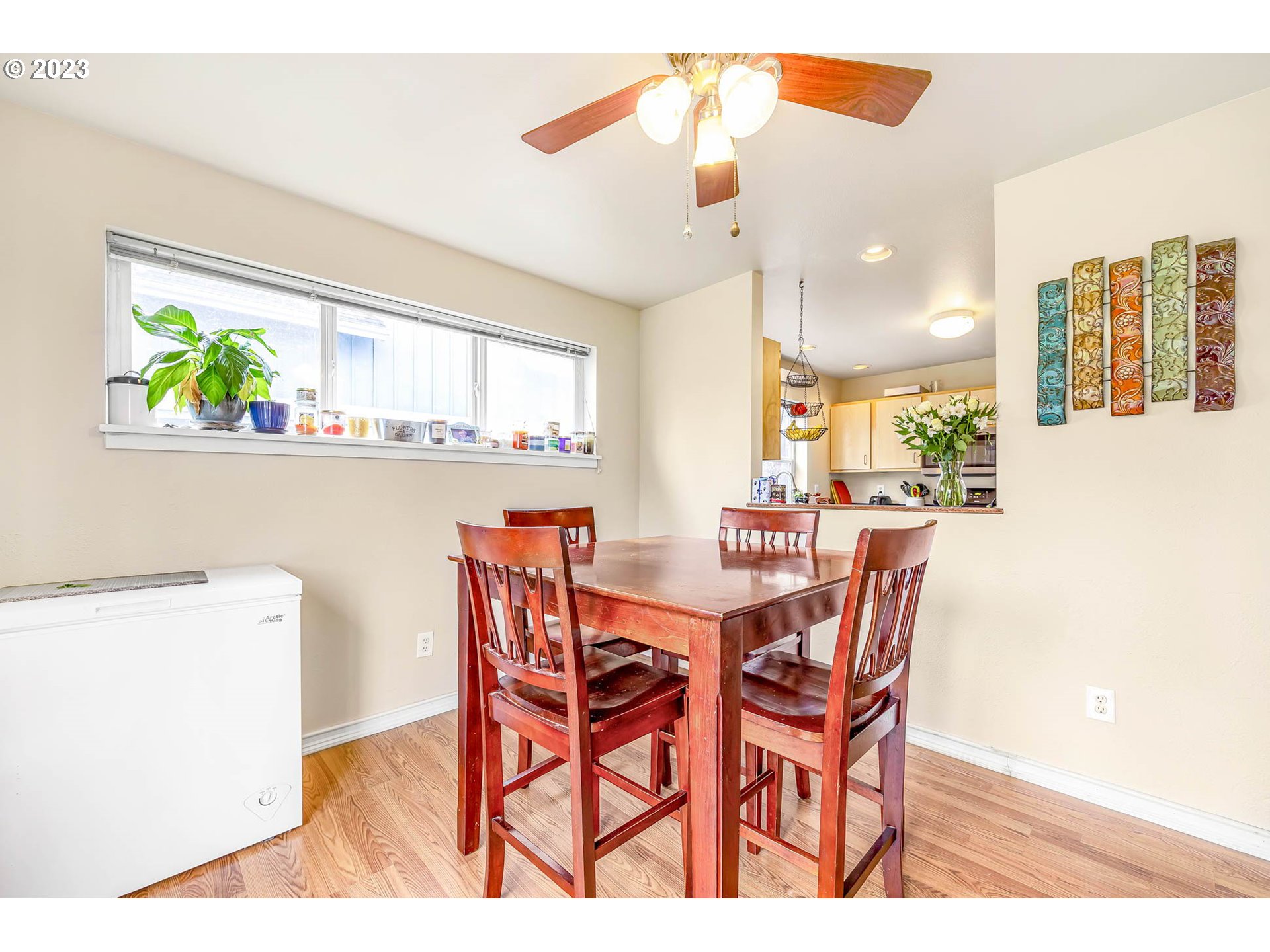 1709 Fairhaven Drive Springfield, OR 97477 - Photo 13 of 26 a view of a dining room with furniture and a potted plant