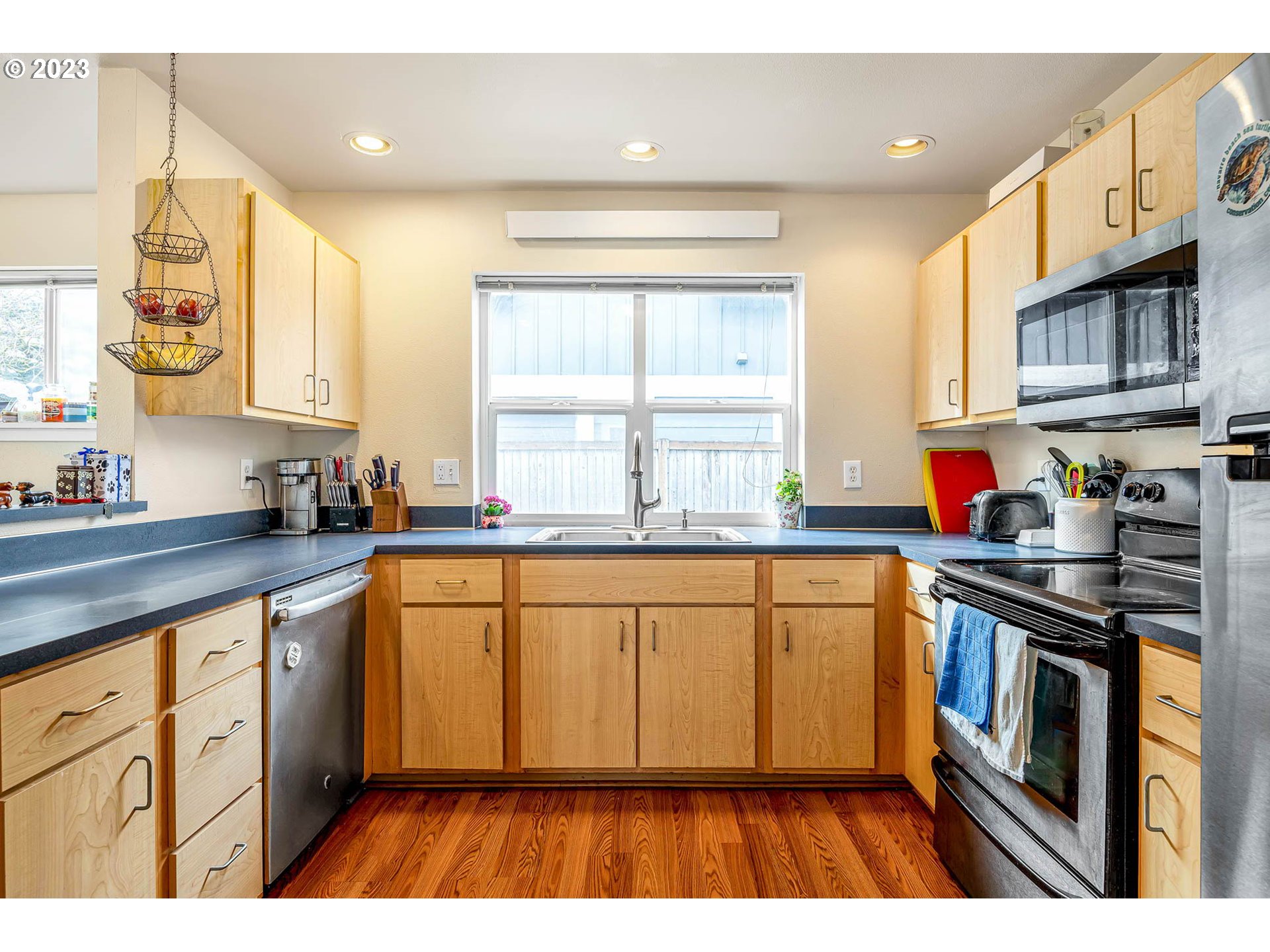 1709 Fairhaven Drive Springfield, OR 97477 - Photo 9 of 26 a kitchen with stainless steel appliances granite countertop a stove a sink and a refrigerator
