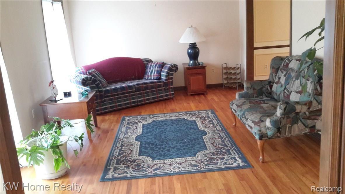 25247 Branchaster Road Farmington, MI 48336 - Photo 2 of 22 Large Living Room with hardwood floors.jpg
