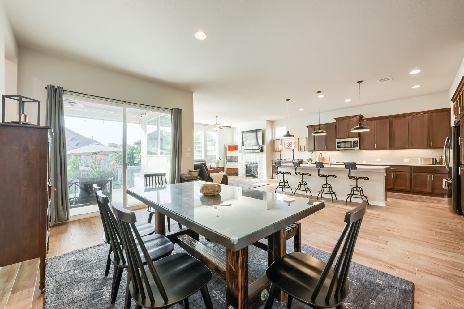 621 Rancho Sienna Loop Georgetown, TX 78628 - Photo 28 of 28 An open floorplan seamlessly connects the dining area, living space, and kitchen.
