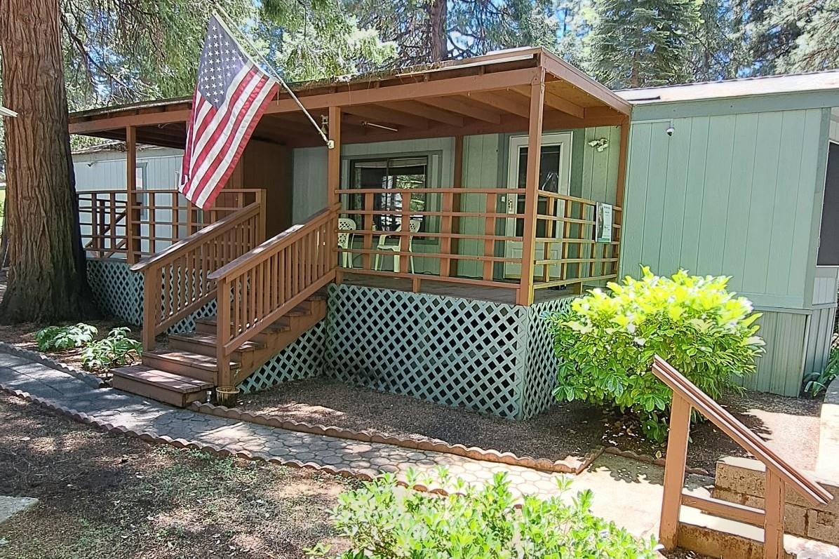 5766 Pony Express Trail, Unit 4 Pollock Pines, CA 95726 - Photo 1 of 17 a front view of a house with a yard