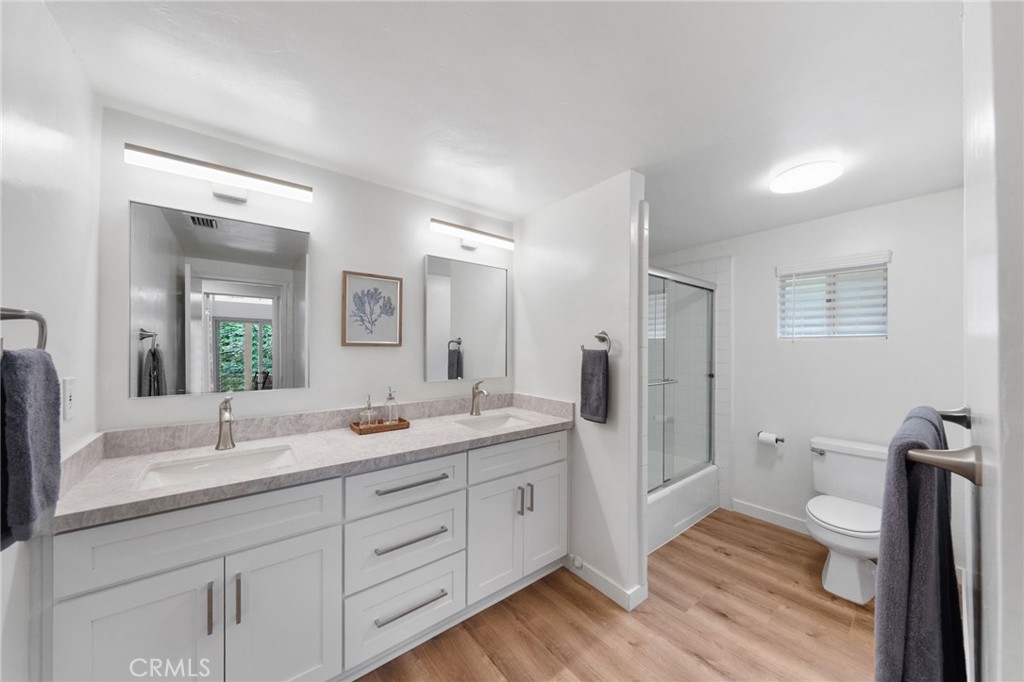 41070 Avenida Verde Temecula, CA 92591 - Photo 28 of 70 a spacious bathroom with a granite countertop sink mirror and toilet