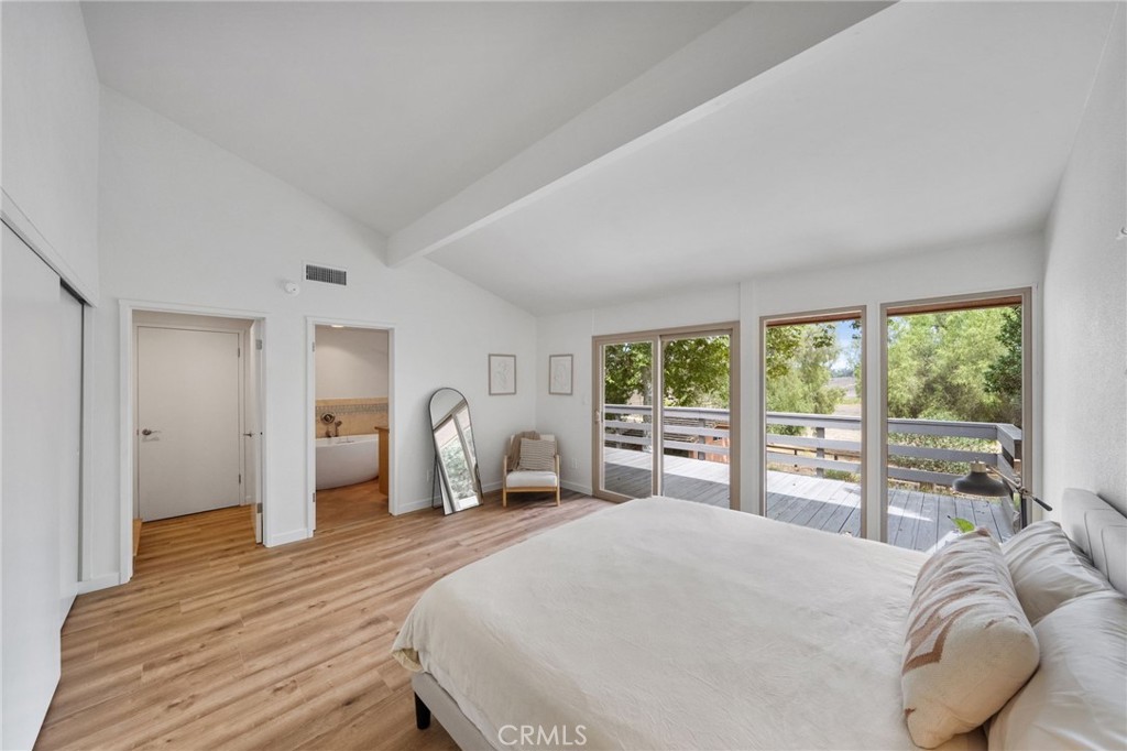 41070 Avenida Verde Temecula, CA 92591 - Photo 30 of 70 a bedroom with a large bed and large windows