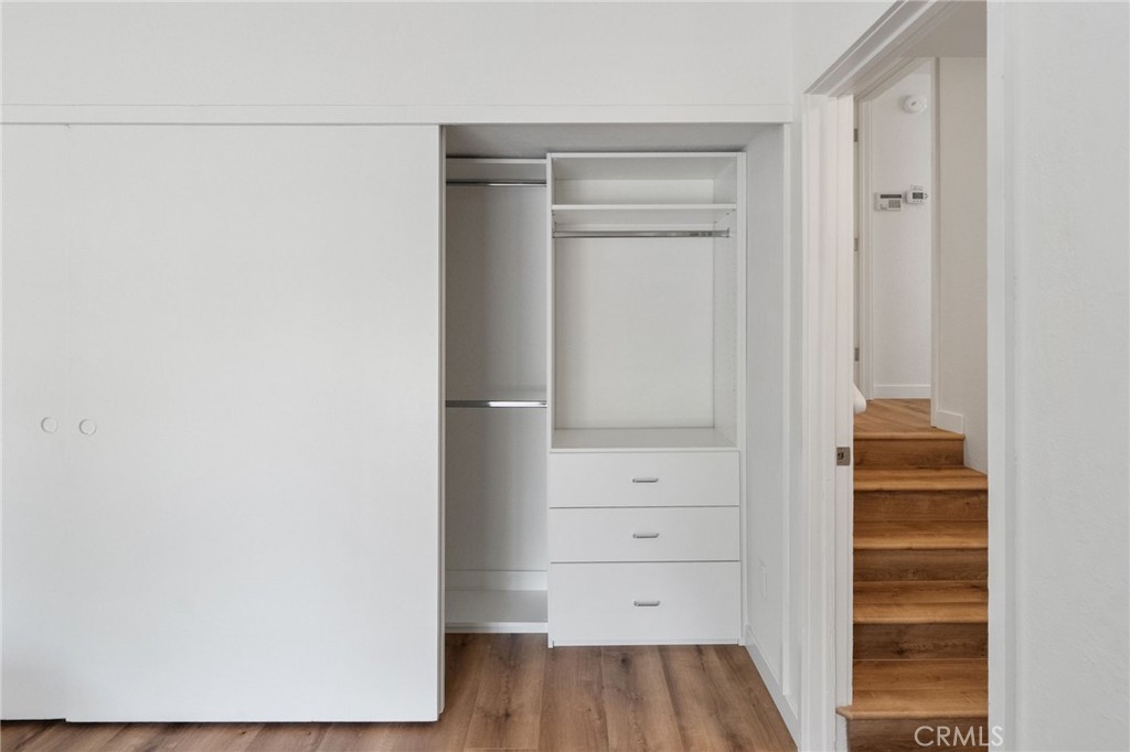 41070 Avenida Verde Temecula, CA 92591 - Photo 33 of 70 a view of walk in closet with wooden floor