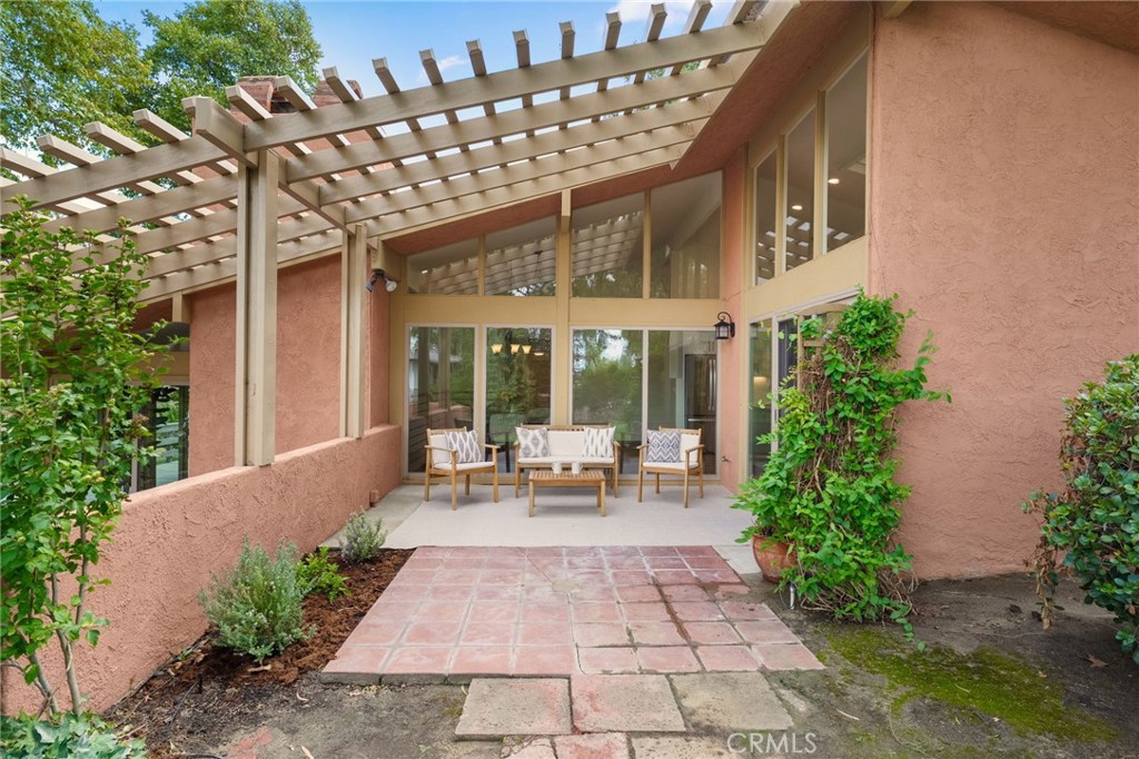 41070 Avenida Verde Temecula, CA 92591 - Photo 36 of 70 a view of a patio with table and chairs potted plants and floor to ceiling window