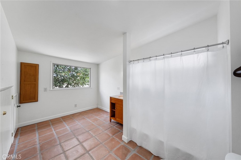 41070 Avenida Verde Temecula, CA 92591 - Photo 57 of 70 a view of an empty room with wooden floor and a window