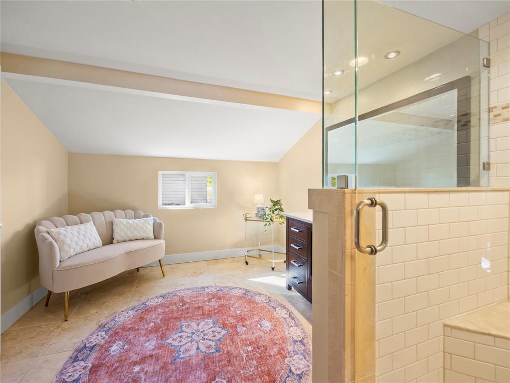 817 Edgefield Road Fort Worth, TX 76107 - Photo 12 of 15 Spacious primary bathroom with walk in shower and seating area