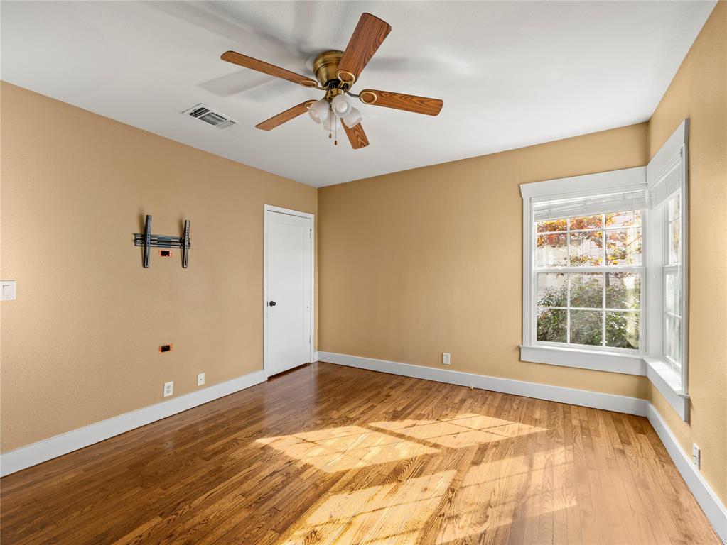 817 Edgefield Road Fort Worth, TX 76107 - Photo 15 of 15 Secondary bedroom with recently finished hardwood floors