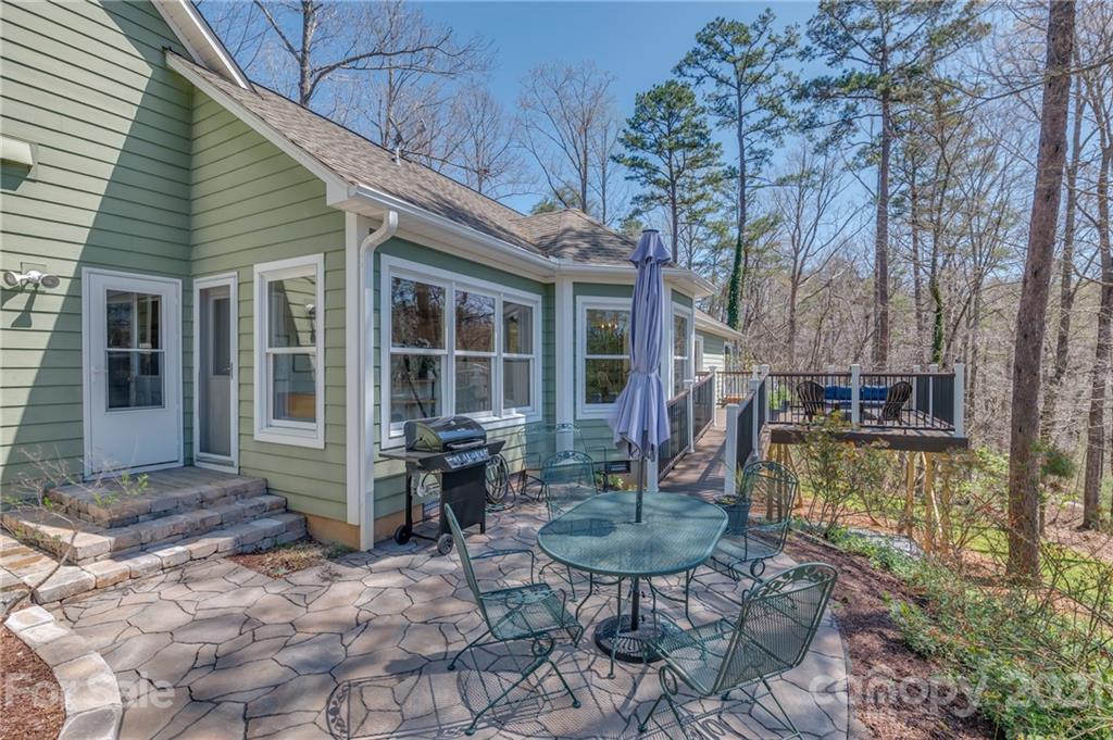 658 South Cove Road Mill Spring, NC 28756 - Photo 1 of 46 a backyard of a house with yard and outdoor seating